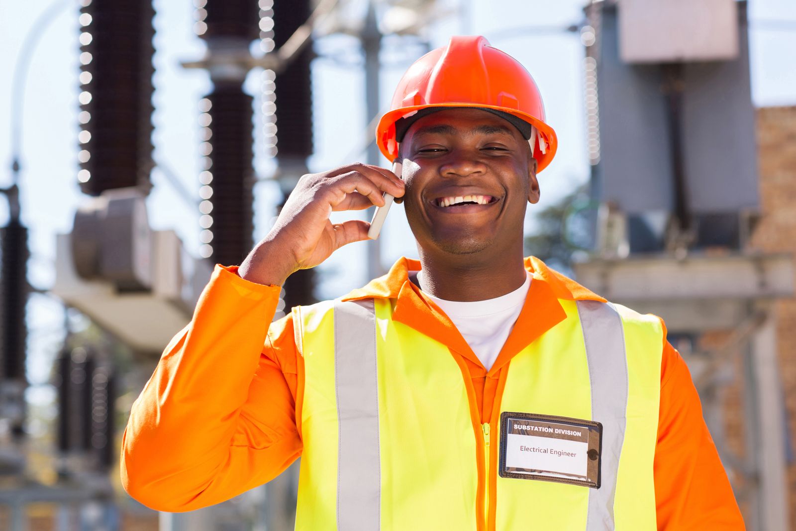 Engineer in hi-vis taking a call on site